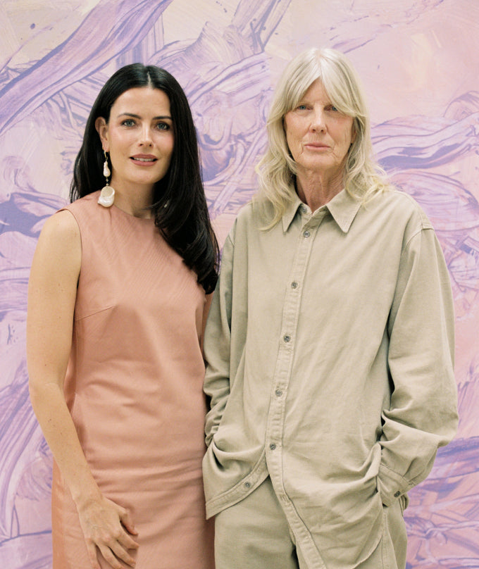 Emma Lewisham and Judly Millar standing side by side against a purple abstract background
